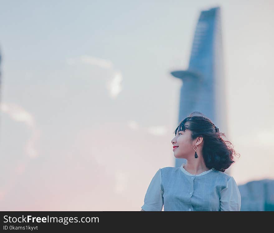 Photo of Woman Wearing Gray Button-up Top