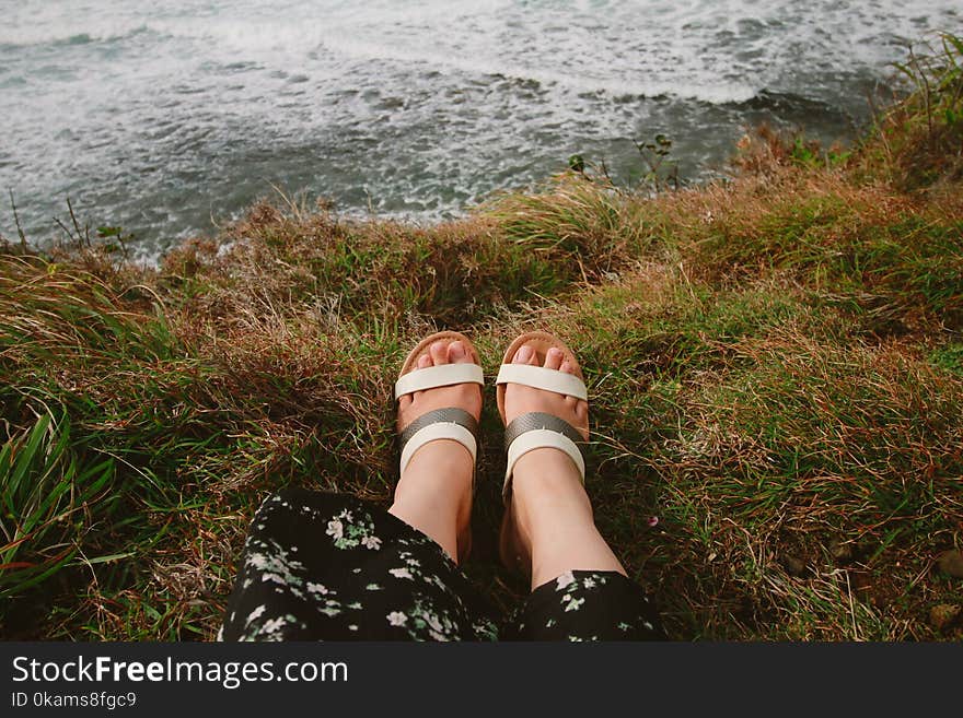 Photography of a Person Wearing Sandals