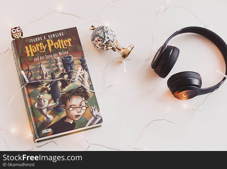 Harry Potter Book and Black Headphones With Trinket