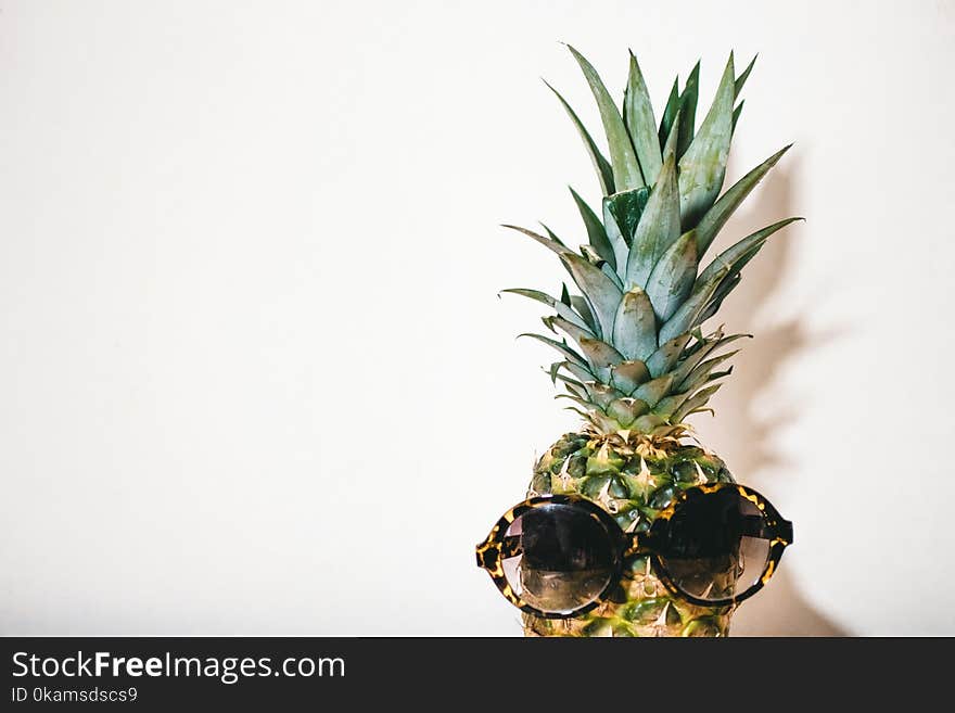 Close-Up Photography of Eyeglasses on Pineapple