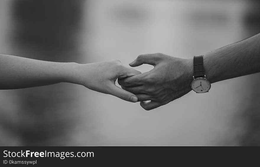 Monochrome Photo of Couple Holding Hands