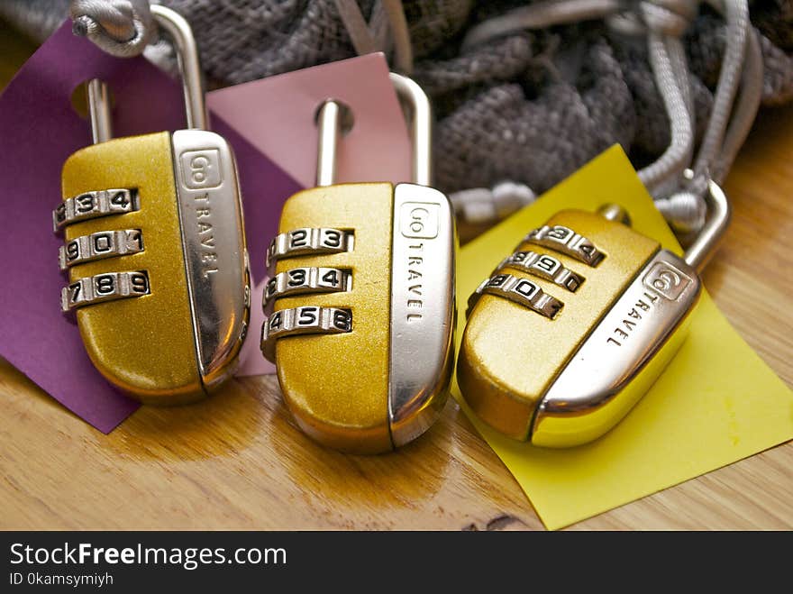 Three Gold-and-silver Combination Padlocks