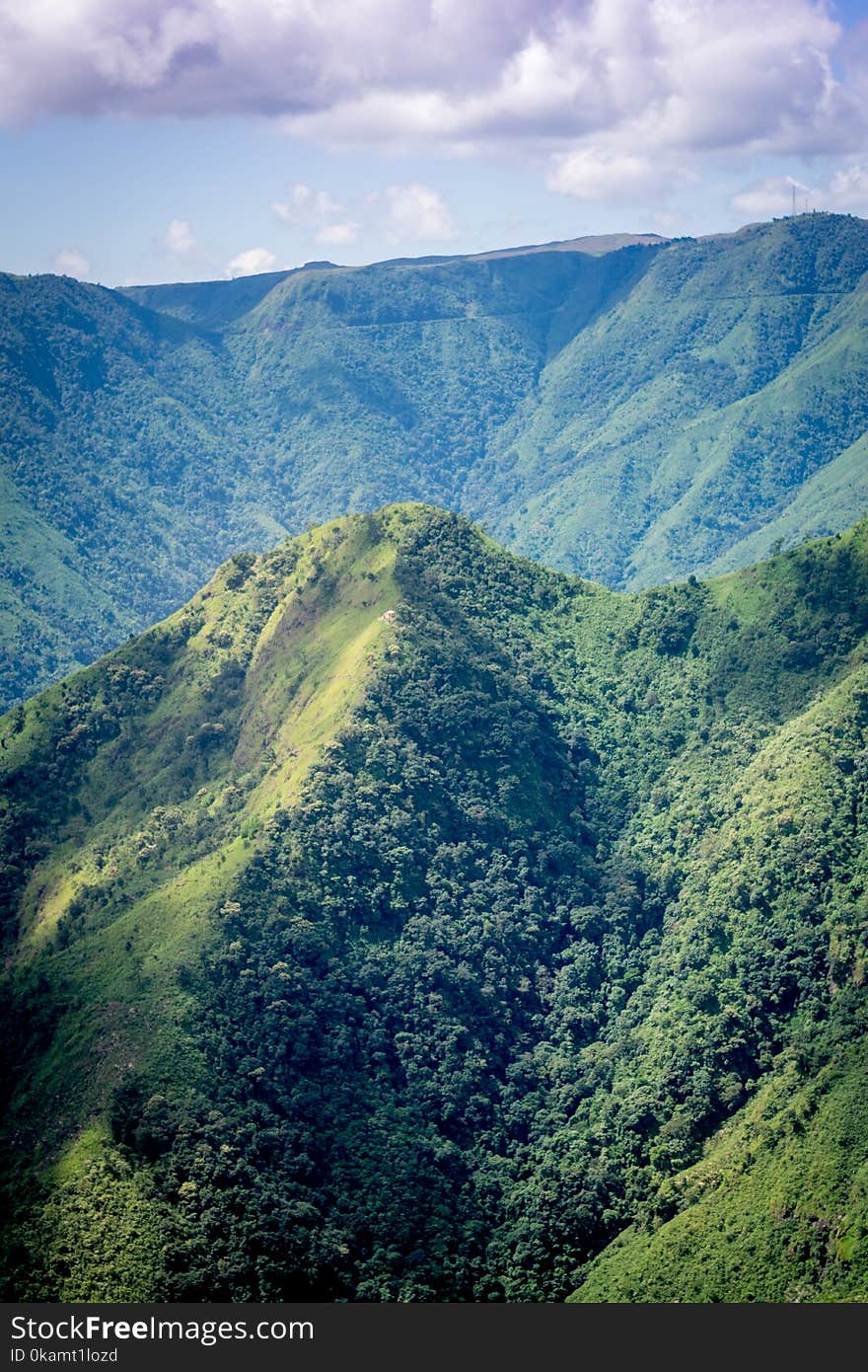 Mountains Covered With Trees Under Cloudy Sky