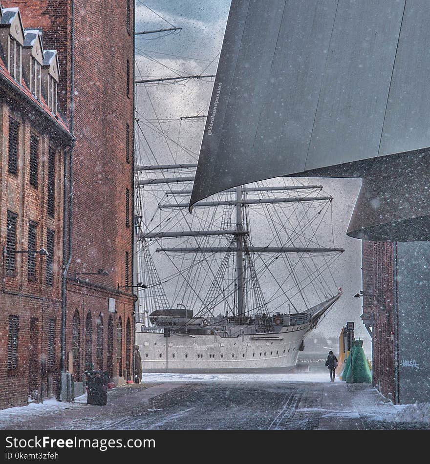 Painting of Man Standing Near White Sailing Ship