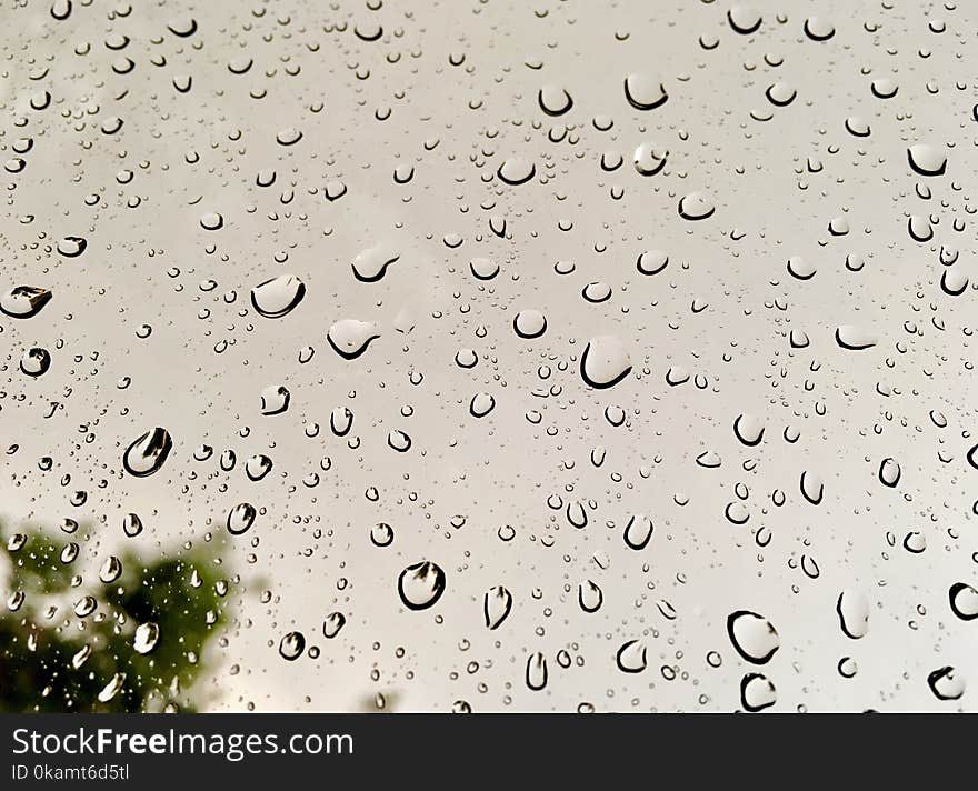 Rain Drops on Glass Window