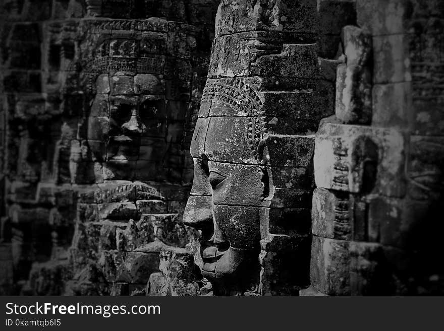 Grayscale Photo of Buddha Statues