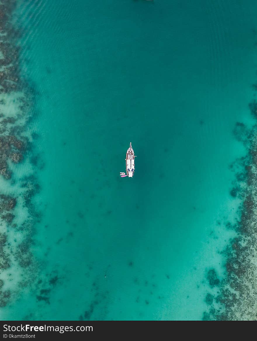 White Boat on Body of Water