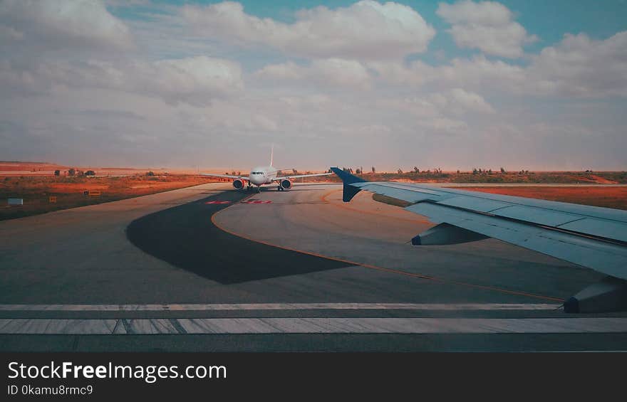 White Airplane on Track