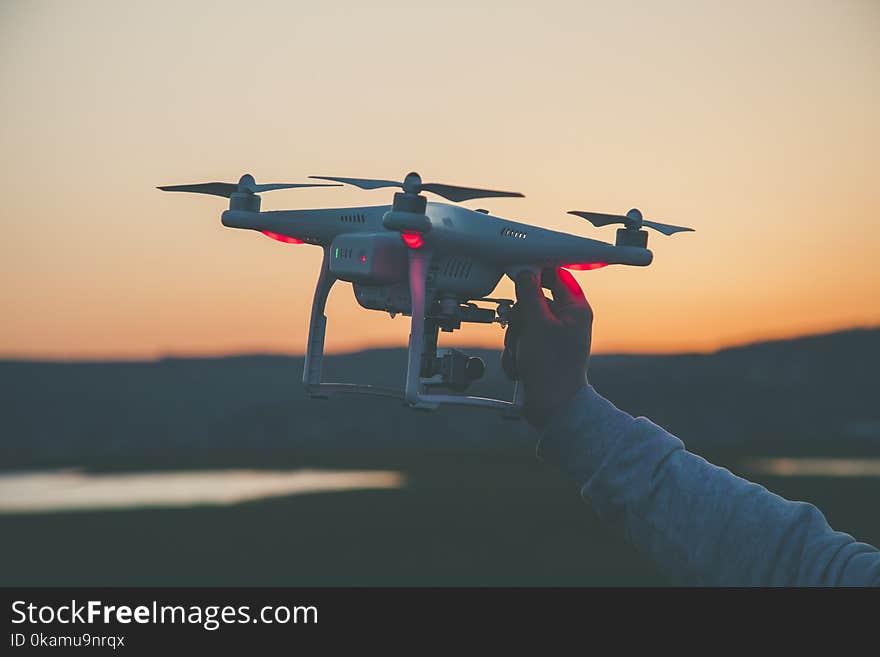 Photo of Person Holding Drone