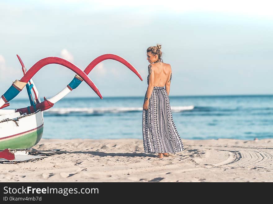 Photo of Woman Standing on Seashore