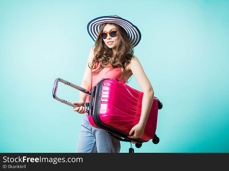 Smiling young tourist woman with bag on color background. Smiling young tourist woman with bag on color background