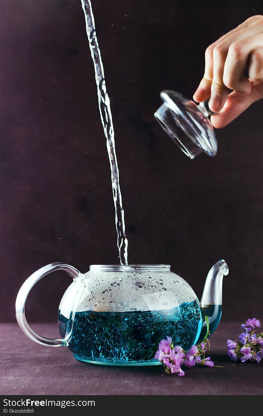 Blue Butterfly Pea Tea Poured In A Glass Teapot On A Table