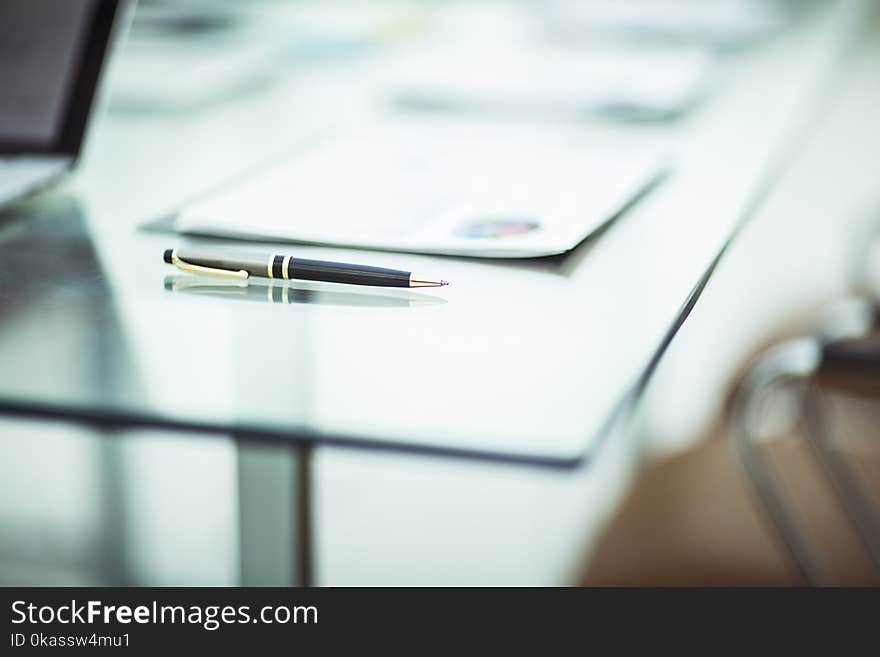 Close-up of pen and financial documents on the table of the businessman. the photo is a blank space for your text