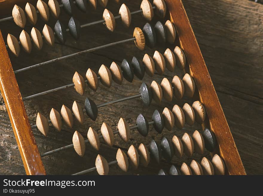 Vintage abacus on an wooden background photo. Vintage abacus on an wooden background photo