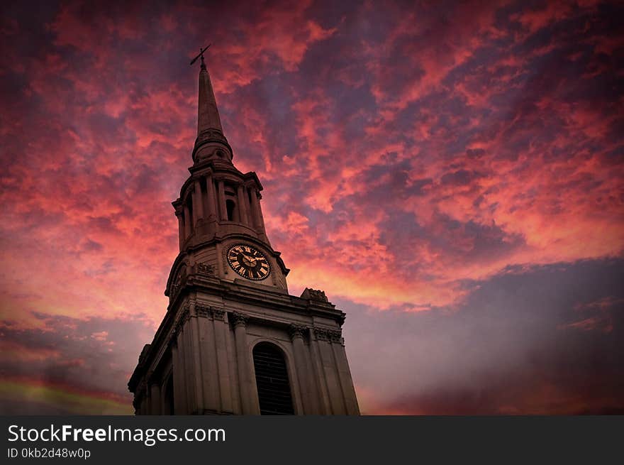 Church tower in London and pink sky. Church tower in London and pink sky