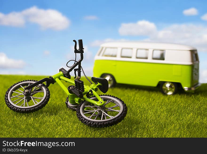 Tourist minivan and bicycle outdoors