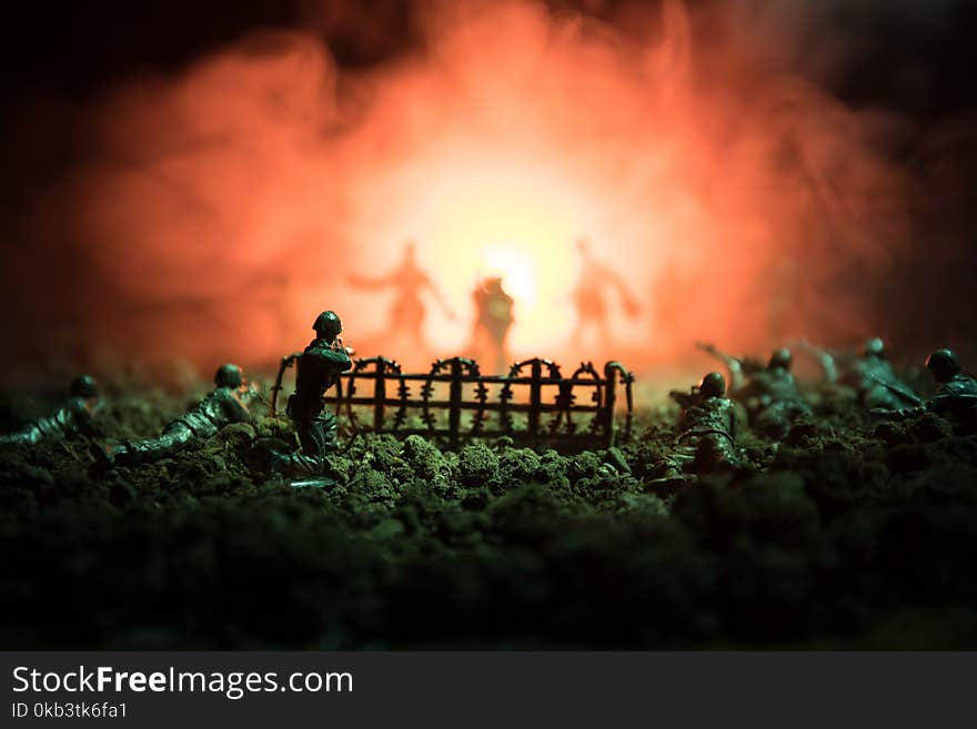 War Concept. Military silhouettes fighting scene on war fog sky background, World War Soldiers Silhouettes Below Cloudy Skyline At night. Attack scene. Armored vehicles. Tanks battle. Decoration