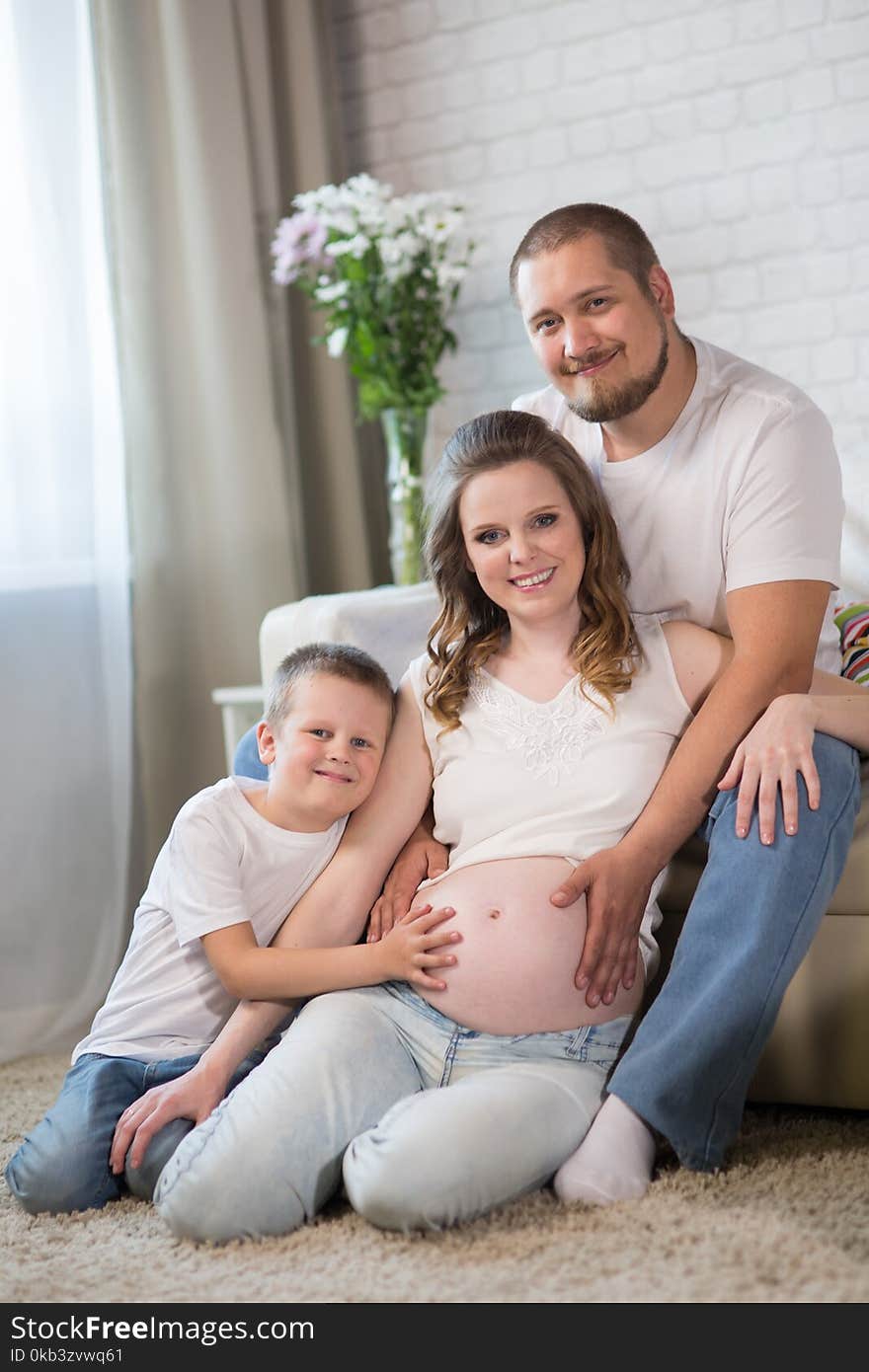 Family with a child and a pregnant mother