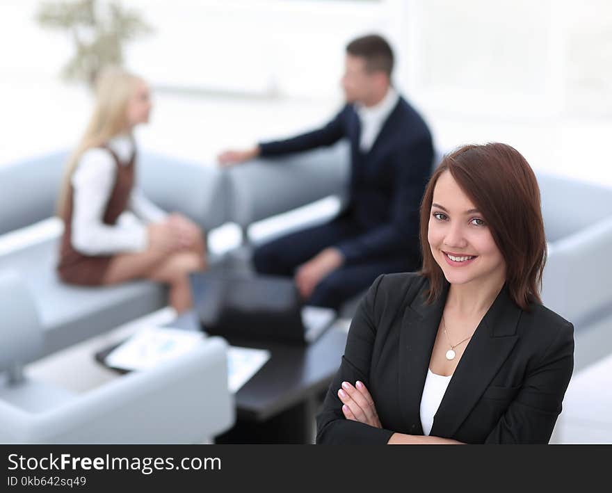 Business women on blurred background office.photo with copy space. Business women on blurred background office.photo with copy space