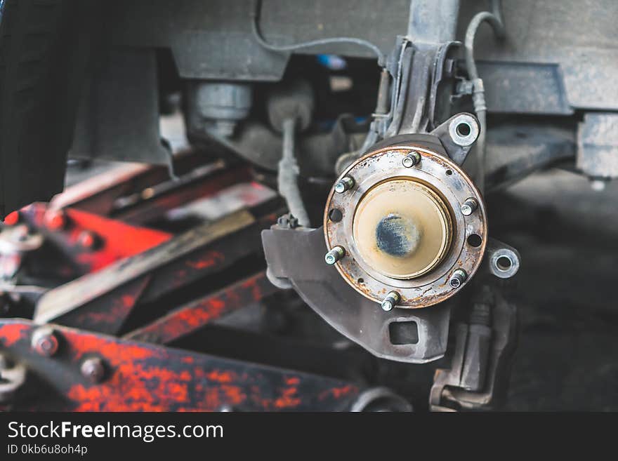 Car brake repair at service station.