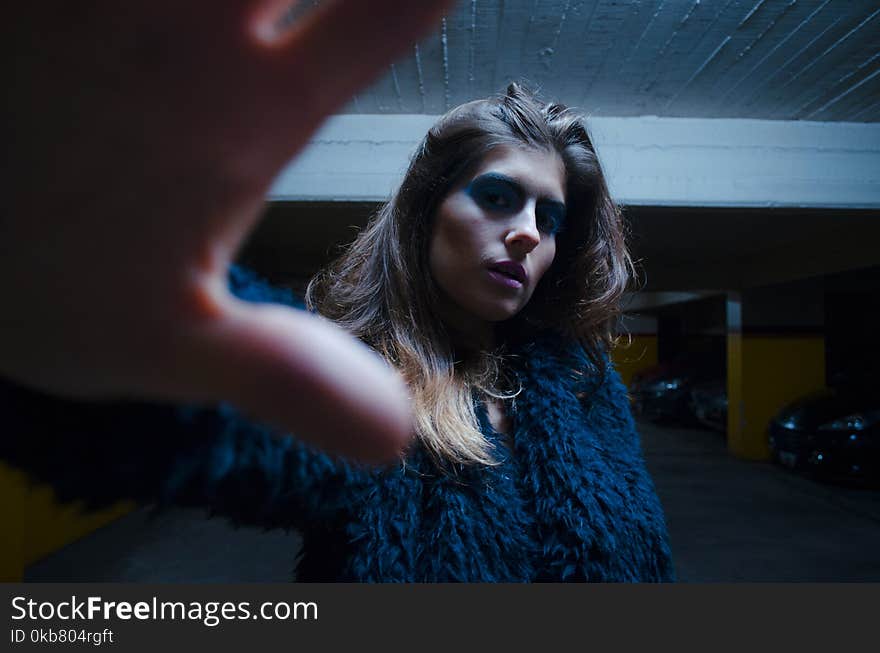 Woman in Blue Fur Top