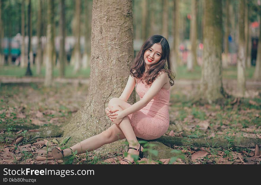 Woman Wearing Pink Sleeveless Dress