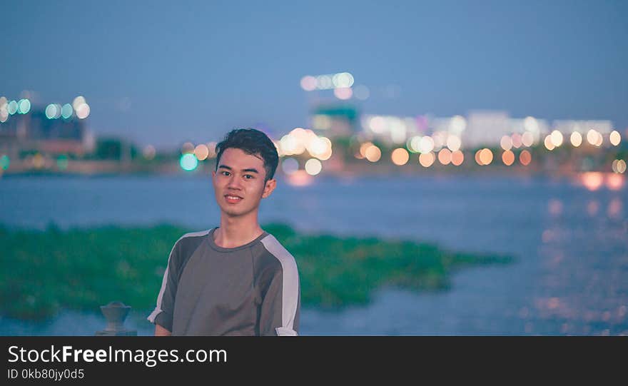 Boy in Gray Crew-neck Shirt Looking Straight to the Camera