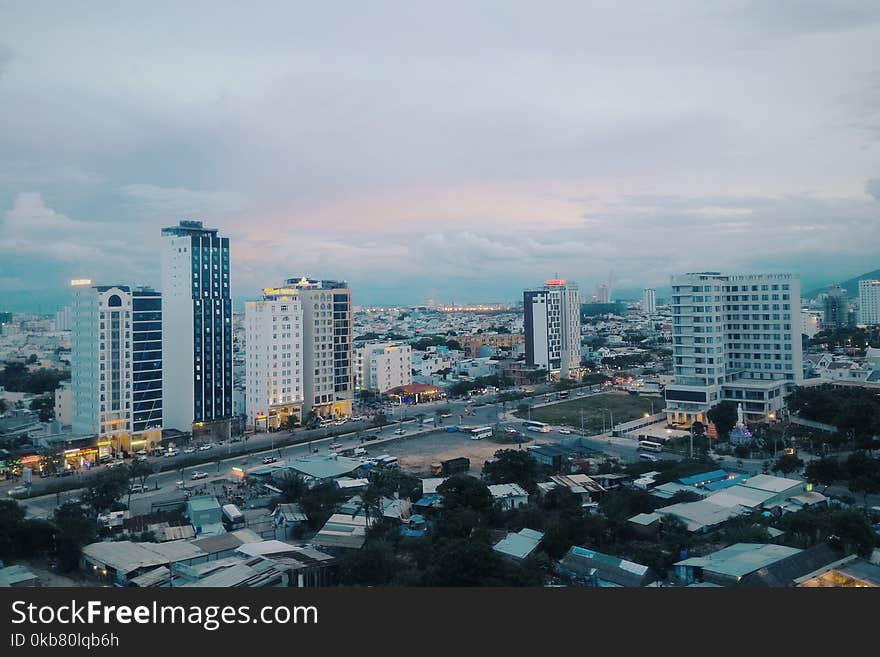 White and Gray Concrete High-rise Buildings at Daytime