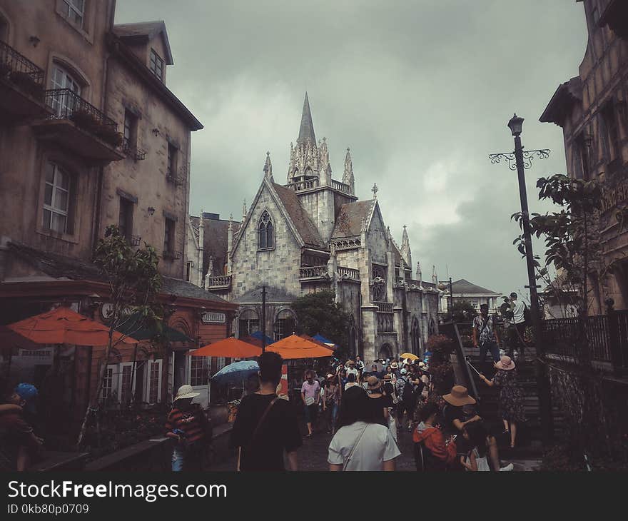 Photography of People Walking on Street Near Buildings