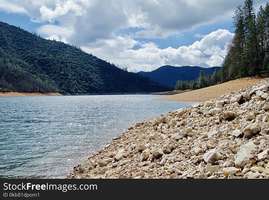 Lake Water Under Cloudy Sunny Sky