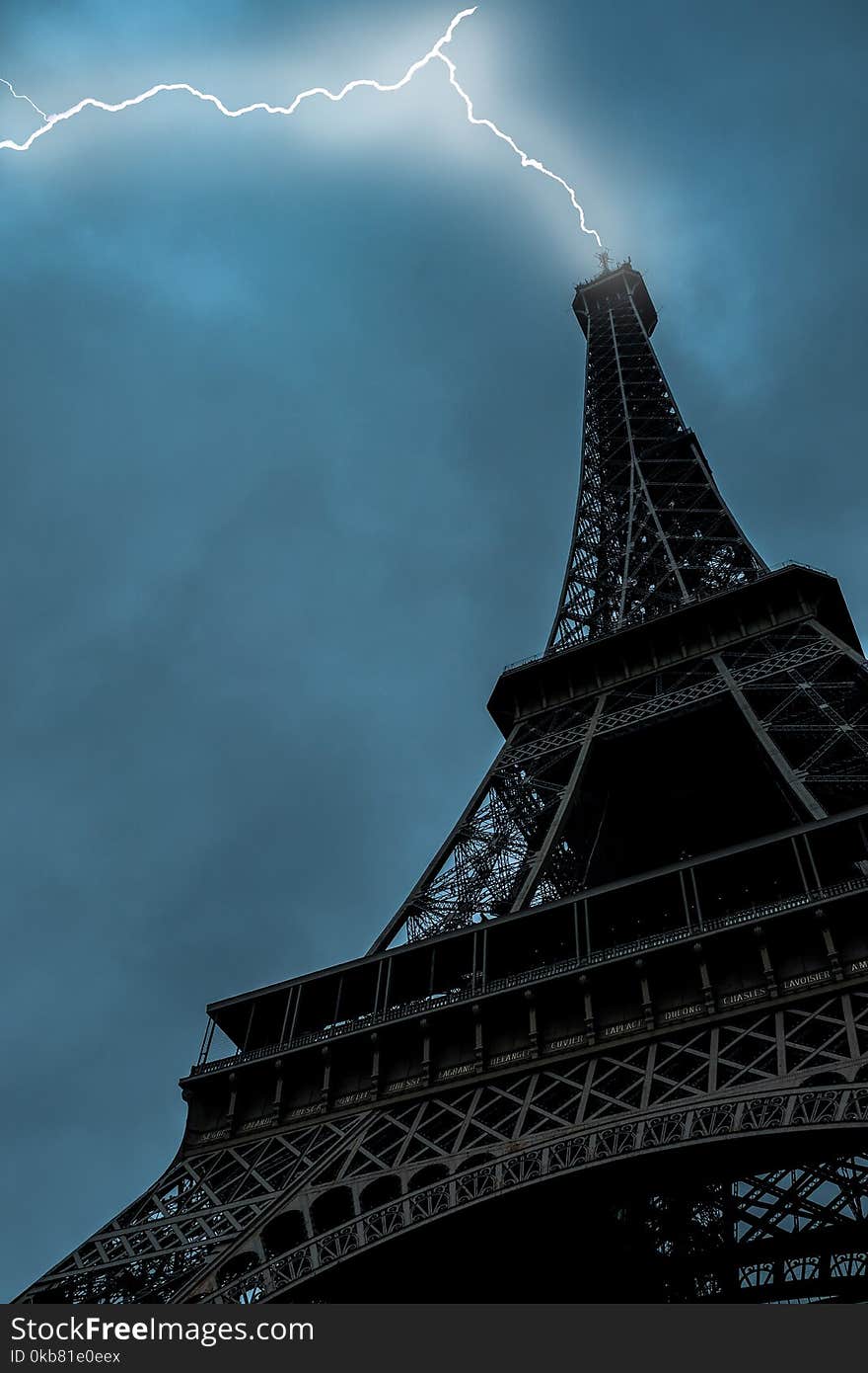 Low-angle Photo of Eiffel Tower Struck by Lightning