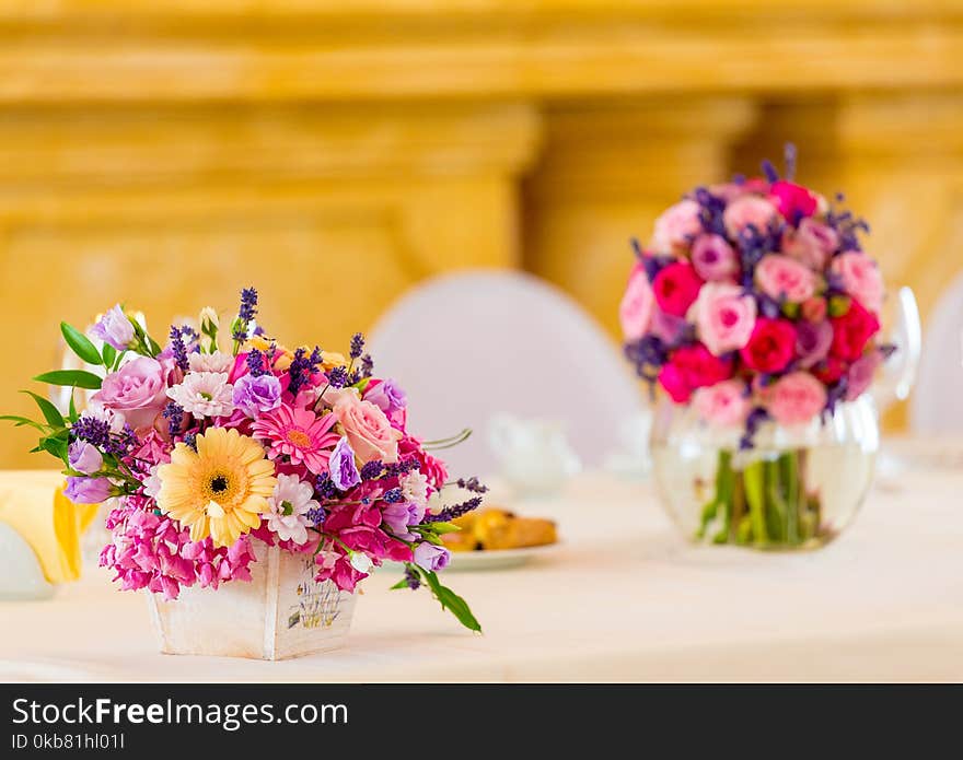 Assorted-color Flowers on White Ceramic Vase