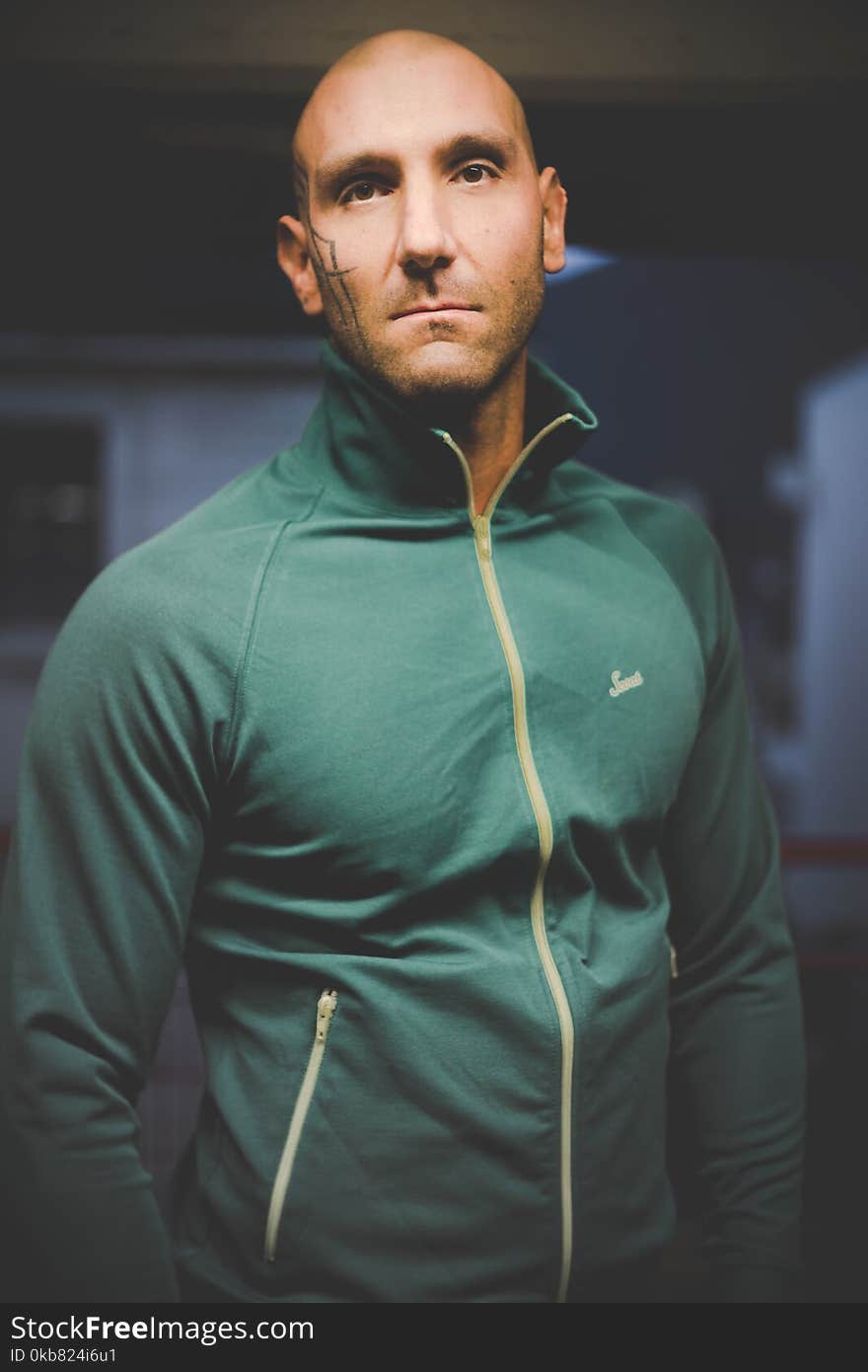 Photo of Man in Green Zip-up Jacket