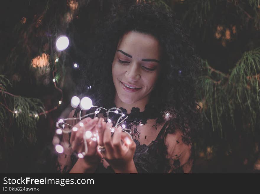 Close-Up Photography Of Woman Holding Lights