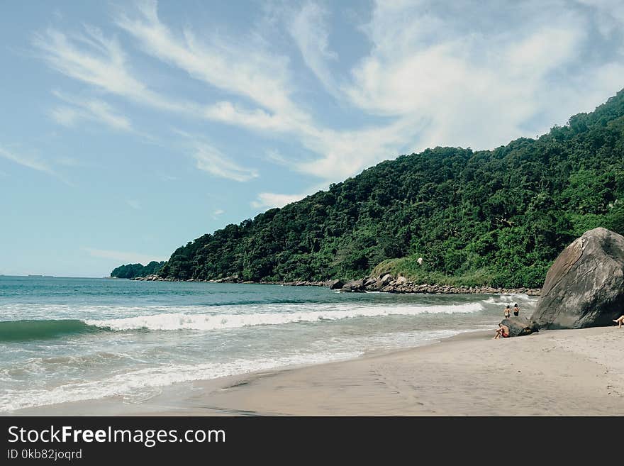 Photography of Seashore Near Mountain