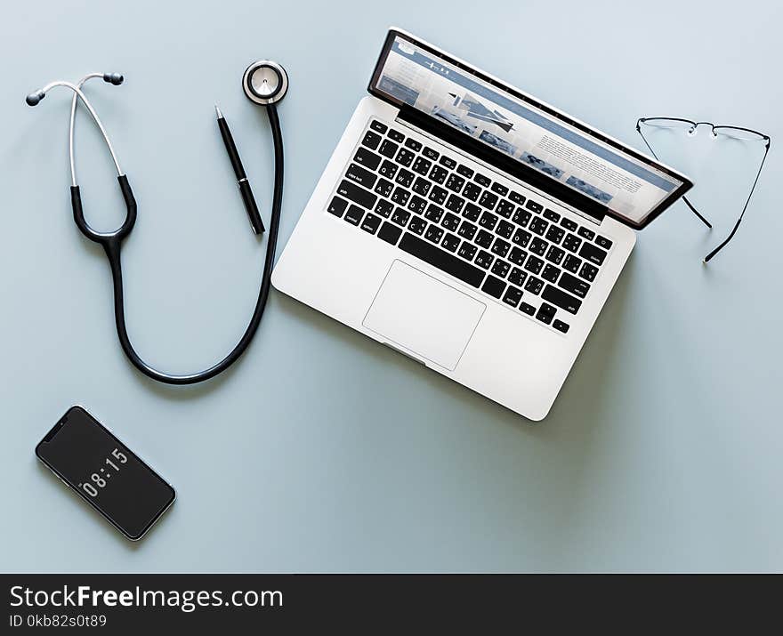 Stethoscope, Pen, Iphone, Macbook, and Sunglasses