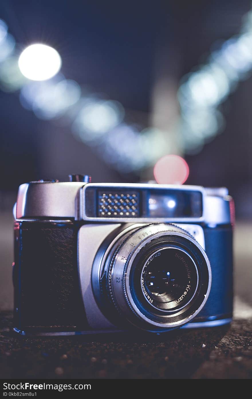 Selective Focus Photo of Gray and Black Slr Camera