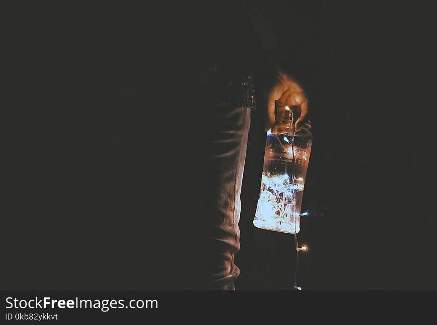 Person Holding Glass Jar