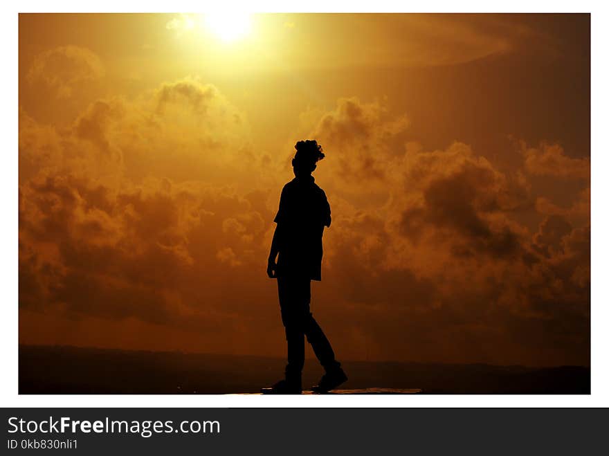 Silhouette of Man During Sunset