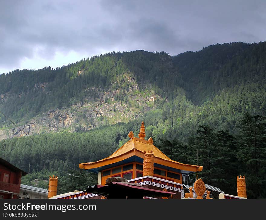 Temple Under Green Forest Mountain