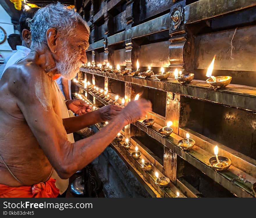 Man Lighting Candles