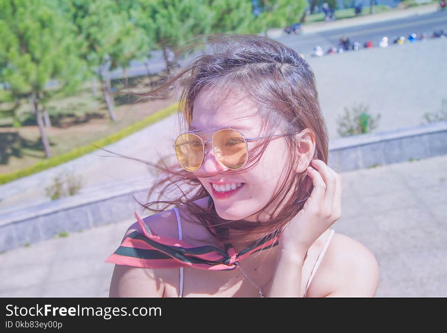 Photography of a Woman Wearing Eyeglasses