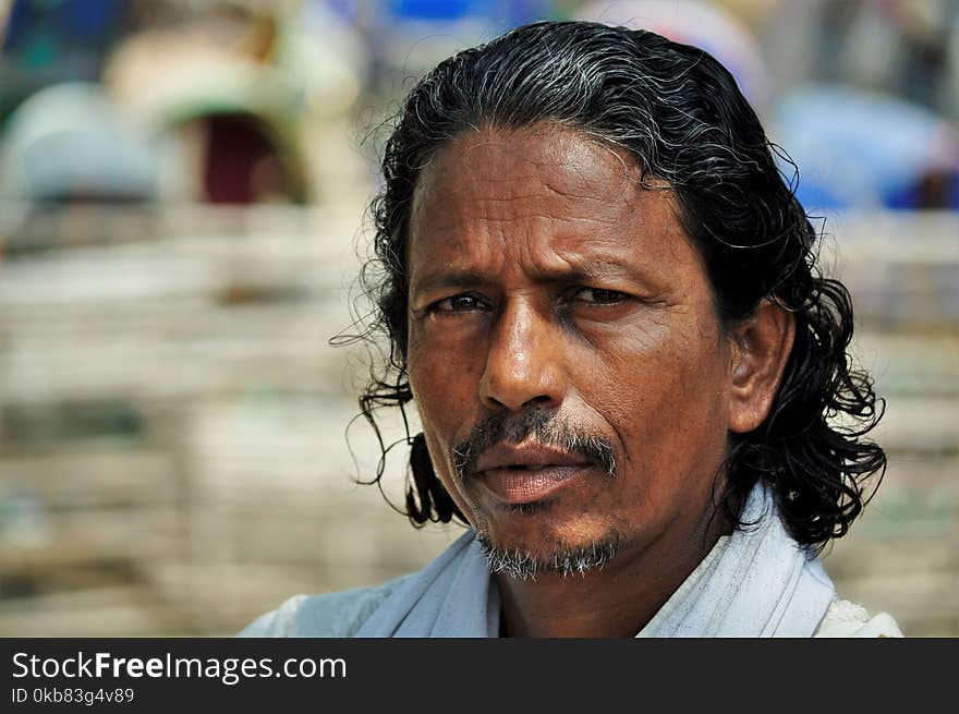 Man in White Collared Top