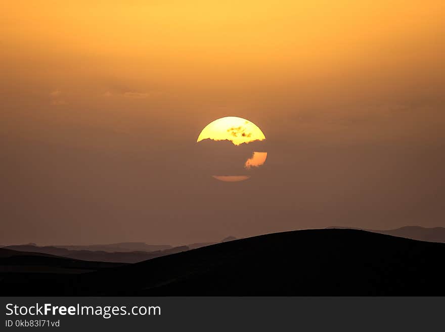 Landscape Photography Silhouette of Hills during Golden Time