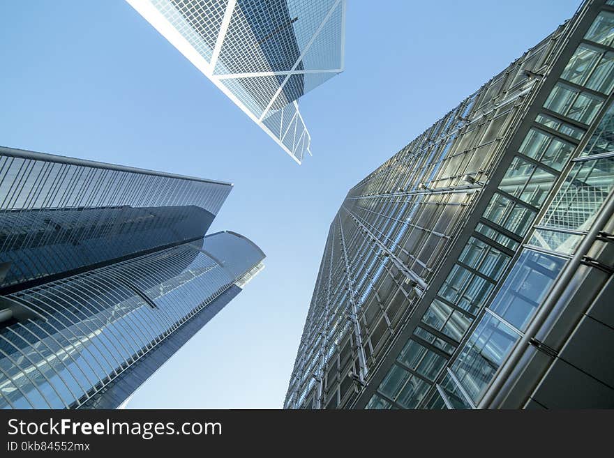 Low Angle Photography of Buildings Under Blue and White Sky