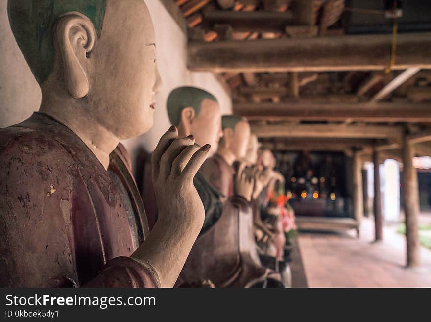 A row of buddah statues in vietnam