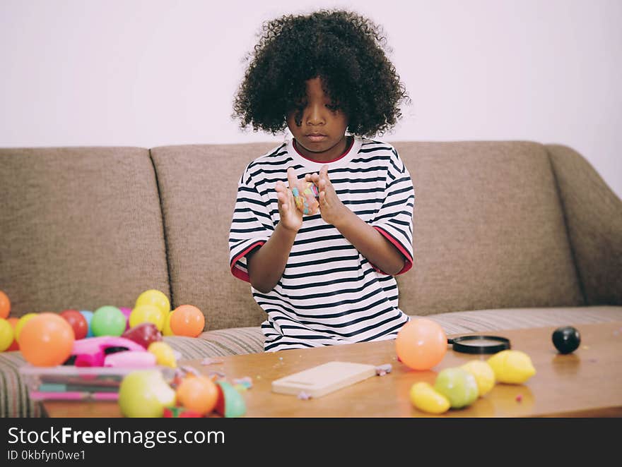 Child Playing Toy In The Living Room