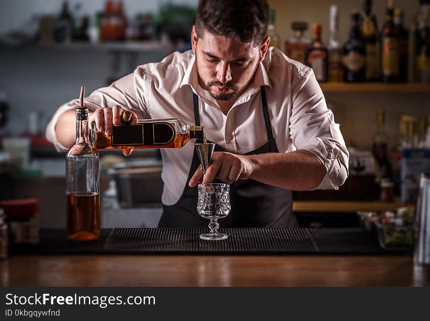 Bartender preparing alcohol cocktail drink