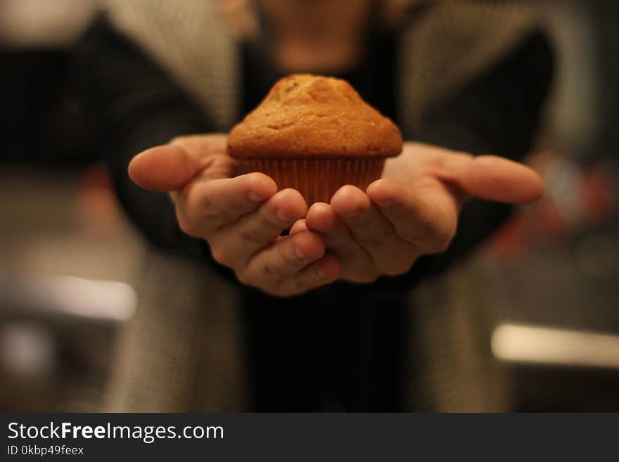 Person&#x27;s Hand With Cupcake