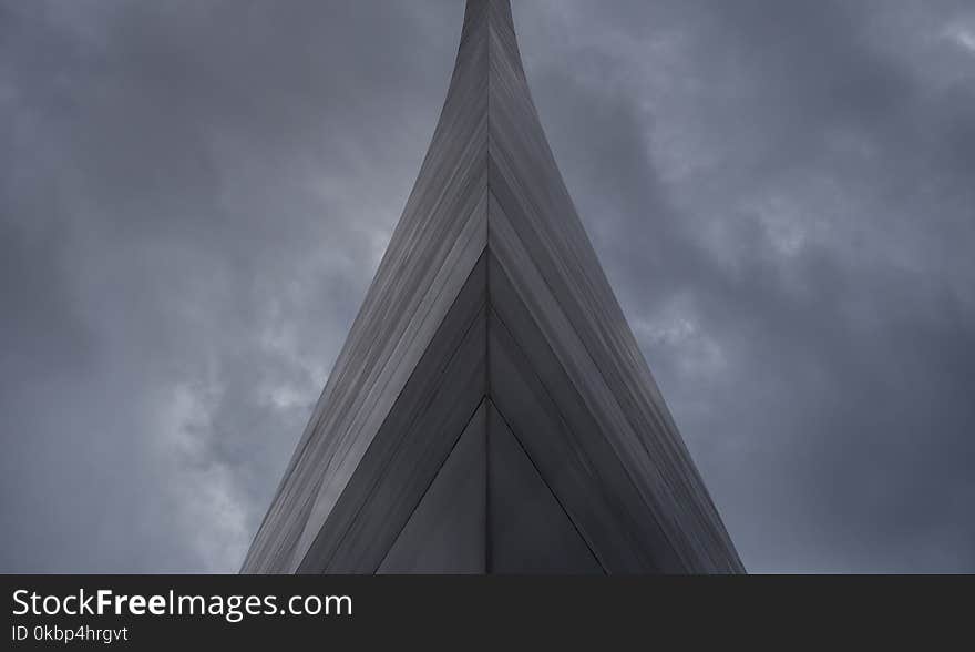 Gray Building Under Dark Clouds